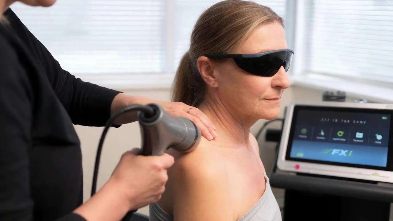 Cold laser therapy on a patient's shoulder at True Health Chiropractic in Lombard, IL