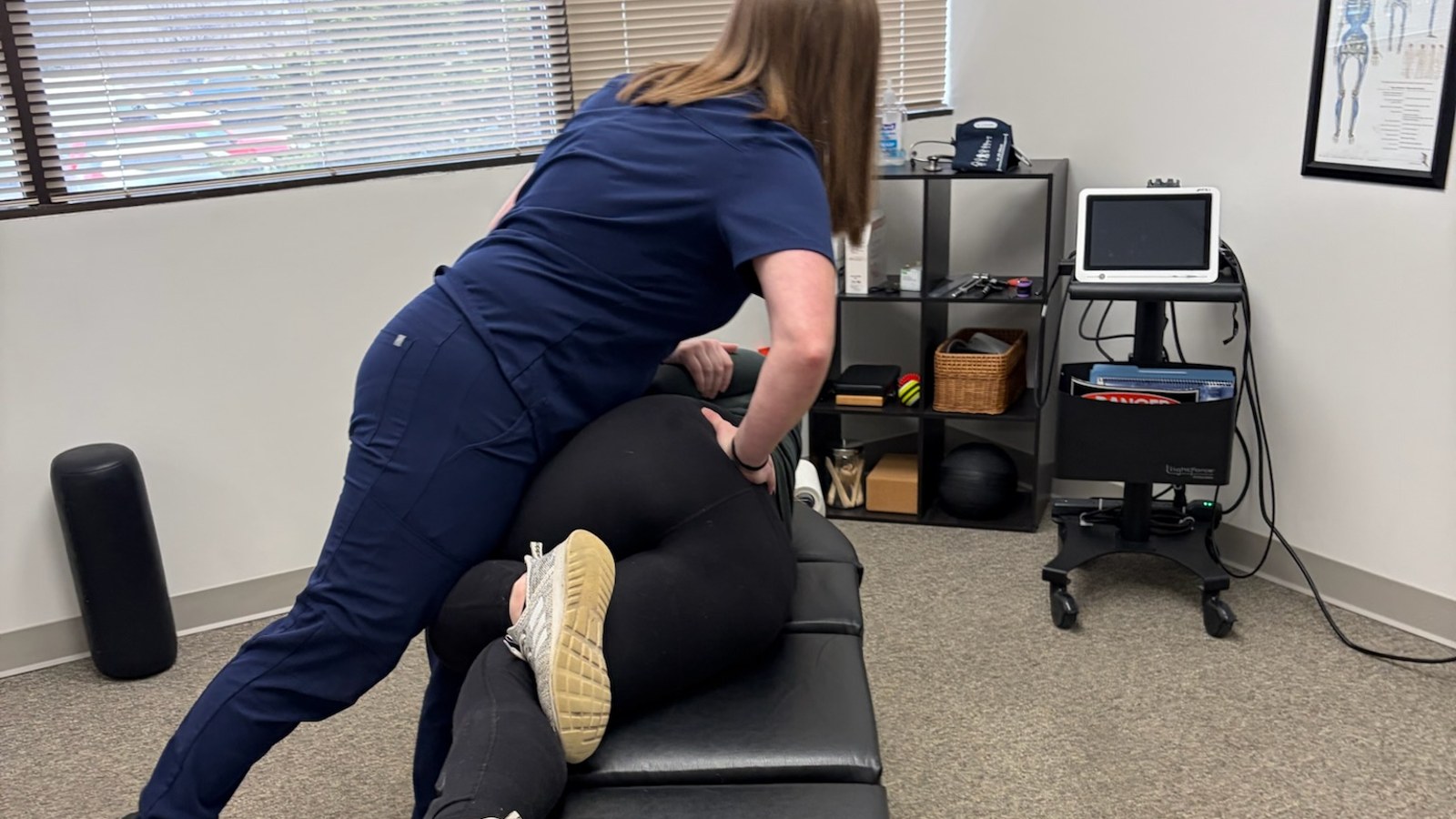 Delayed whiplash symptoms exam: Dr. Amanda Myers performing a chiropractic adjustment at True Health in Lombard, IL